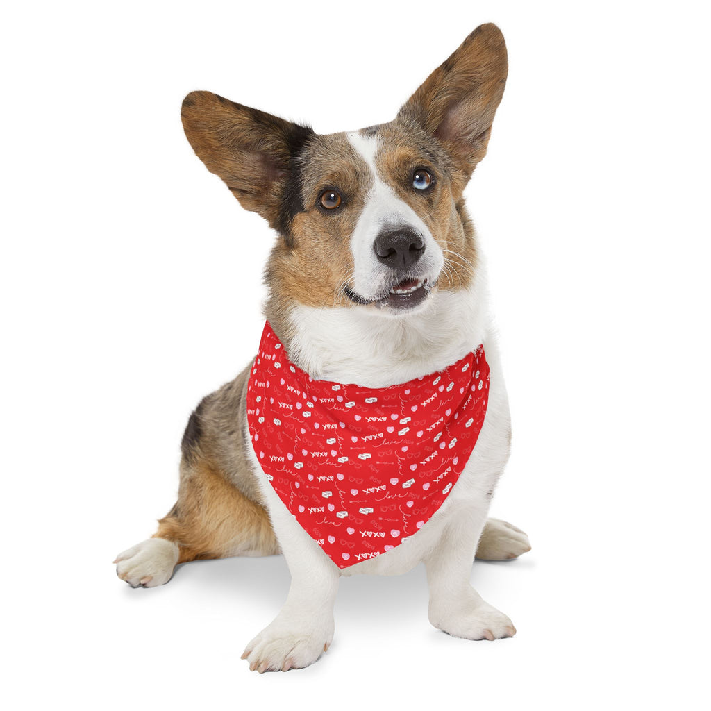 Dog wearing a red bandana with white patterns on a white background