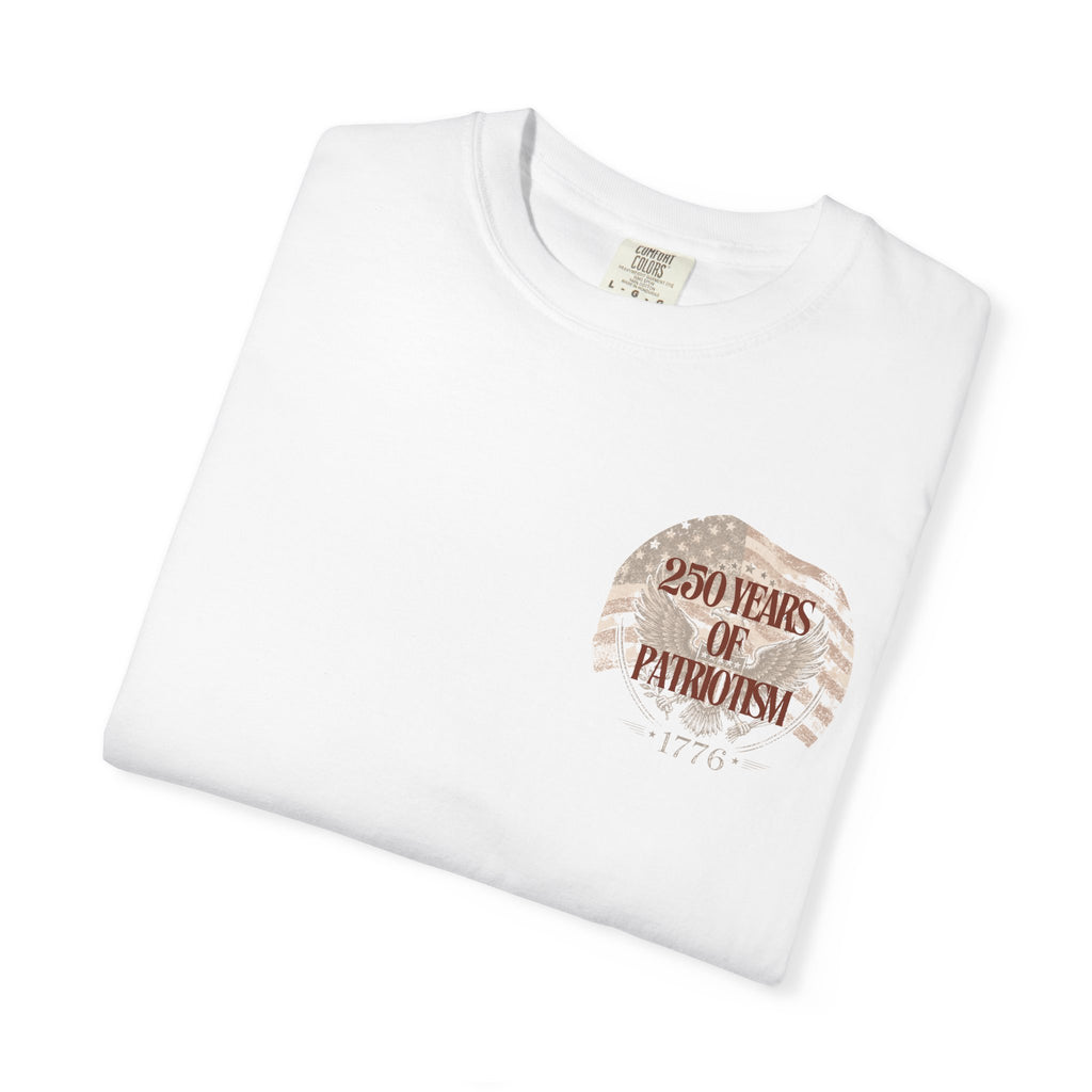 Folded cream-colored t-shirt with a graphic design and text on a white background