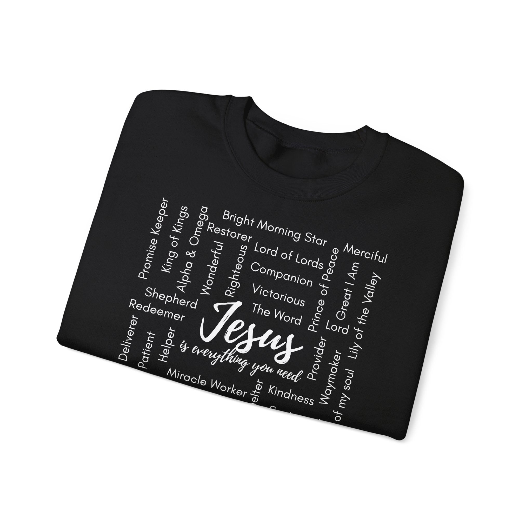 Folded black sweatshirt with Jesus is everything you need words in white