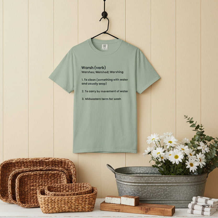 Green t-shirt with black text on a white background